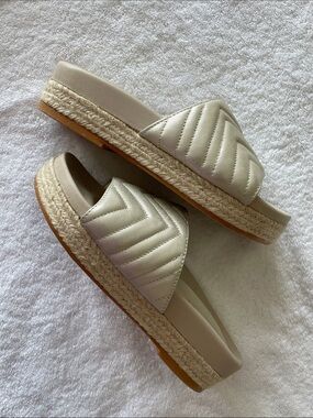 LODI, Metallic Gold Quilted Slide Sandals with Espadrille Detail on Sole.